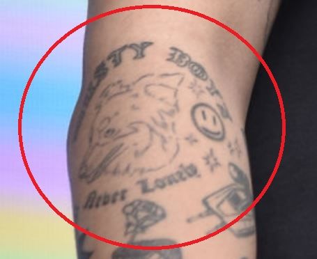 Cuco tattoos: inline smiling dog forearm tattoo image
