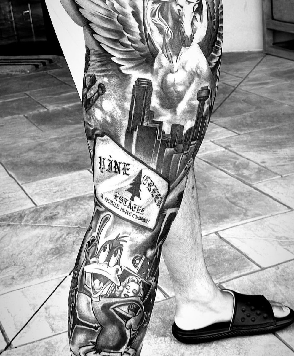 Dak Prescott full leg tattoo sleeve with skyline and Daffy Duck