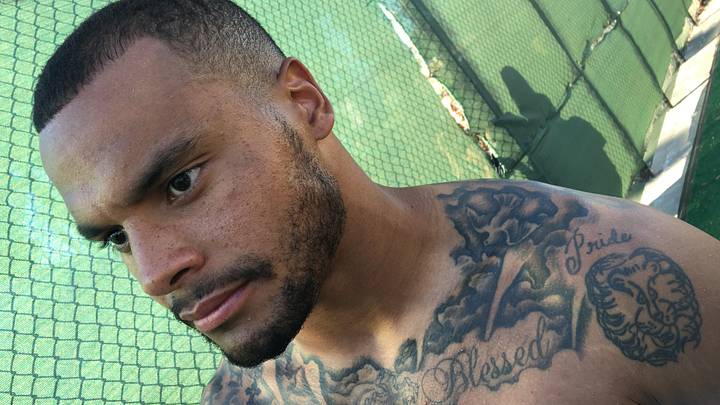 Dak Prescott lion shoulder tattoo and Blessed chest lettering