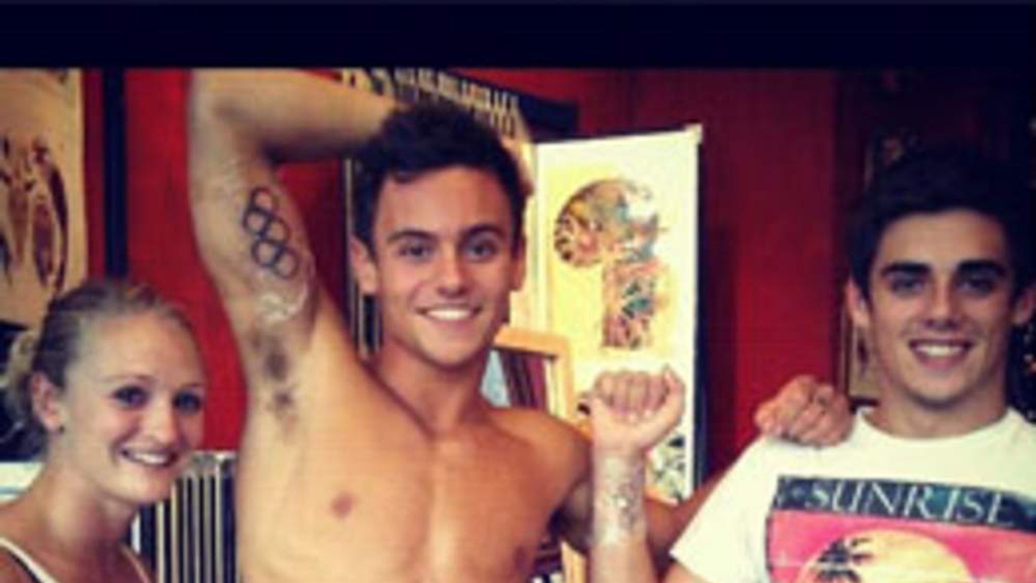 Tom Daley with the Olympic rings tattoo visible on his upper arm