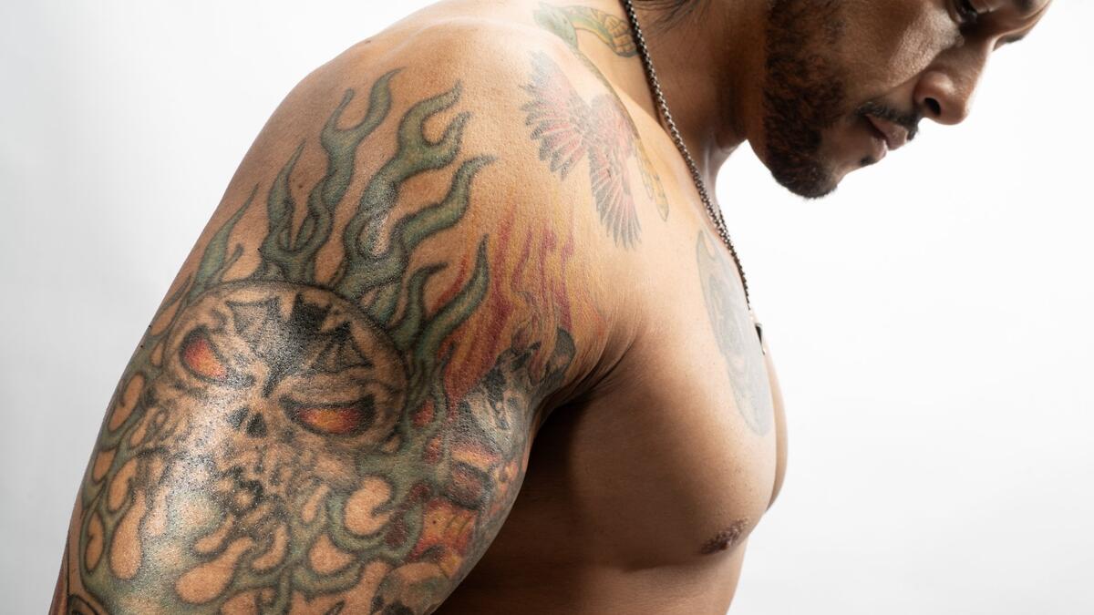 Damian Priest left arm tattoo detail