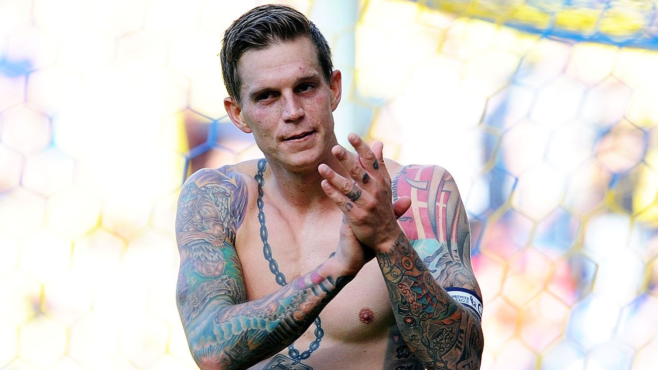 Daniel Agger tattoos: front view of Daniel Agger's chest chain, shoulders, and torso tattoos