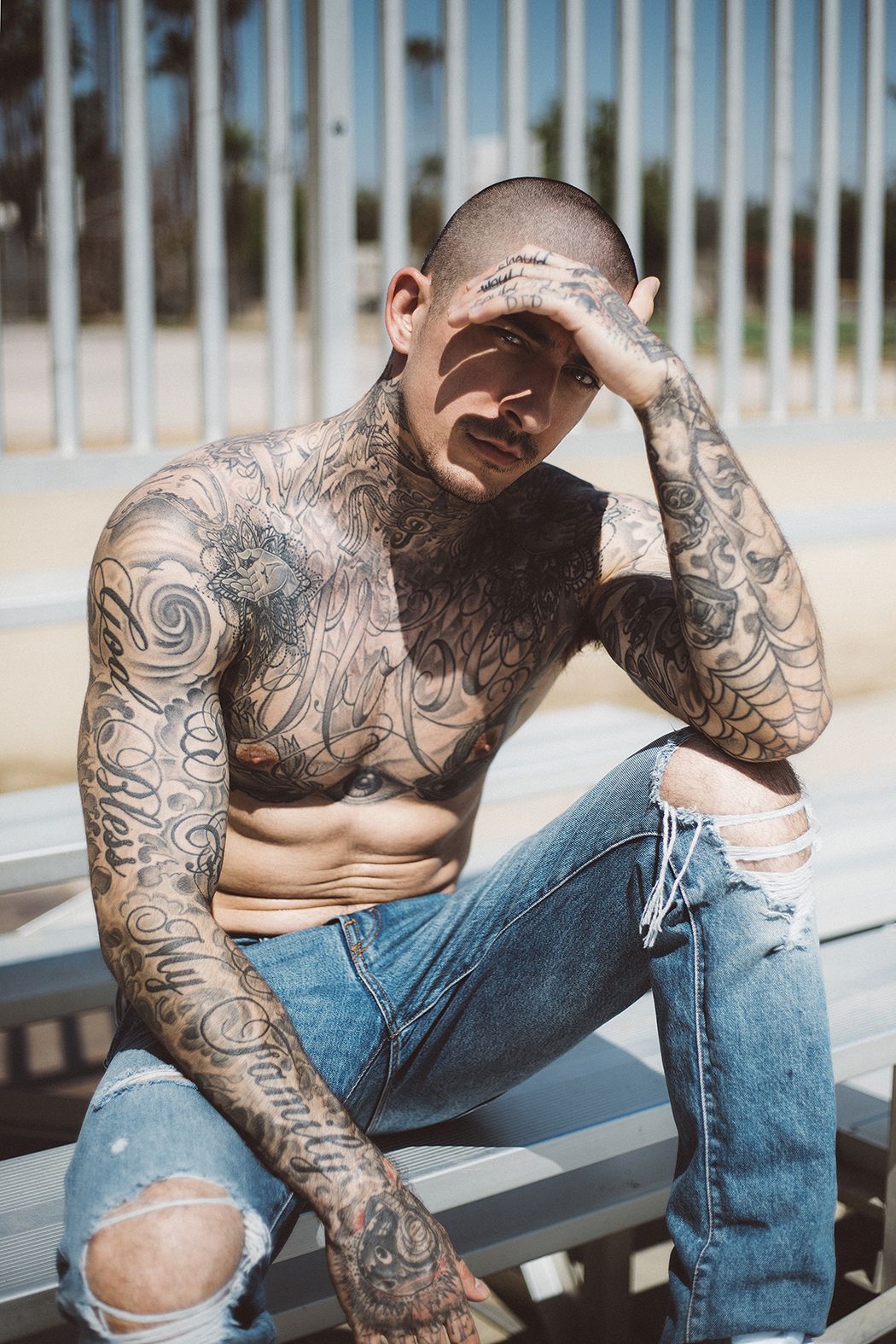 Daniel Bamdad tattoos: God Bless My Family on his right arm