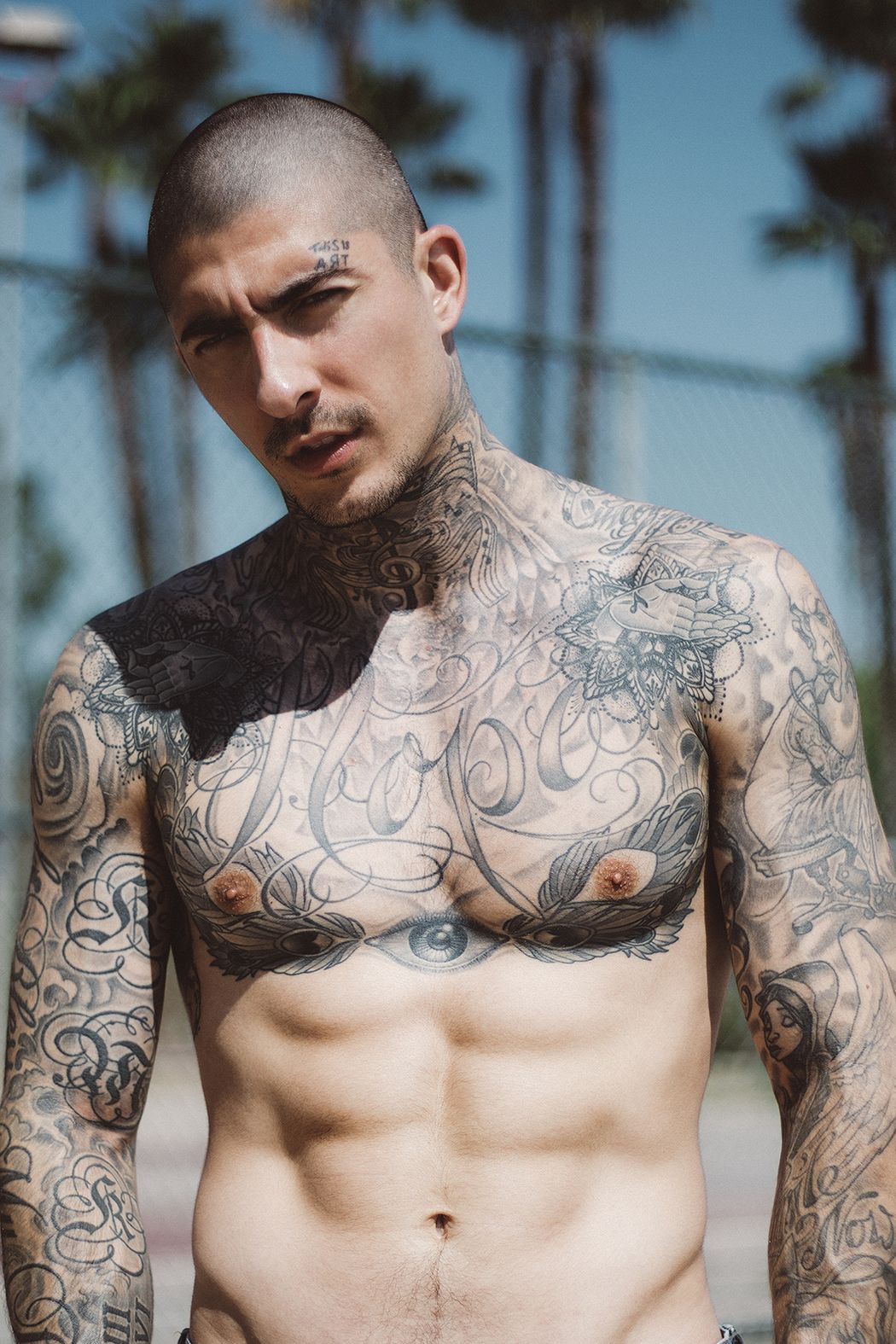 Daniel Bamdad tattoos: Hope chest lettering and the eye below it