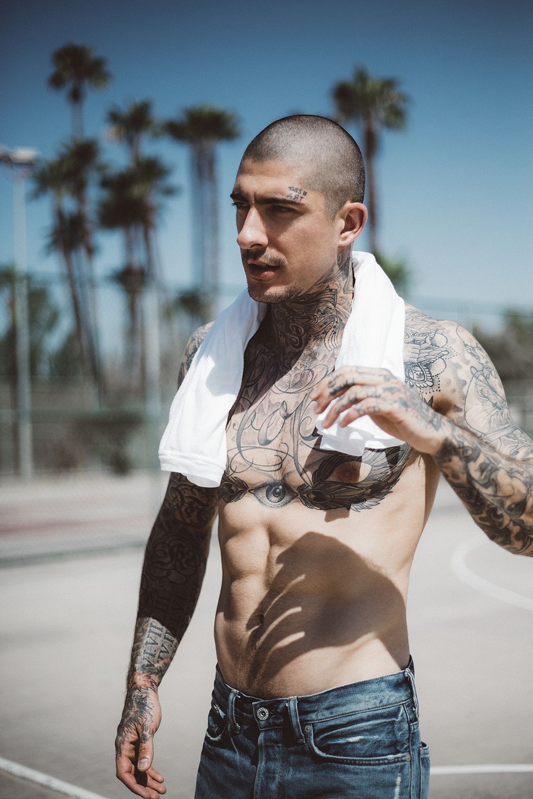 Daniel Bamdad tattoos: Treble clef and music lines on his neck