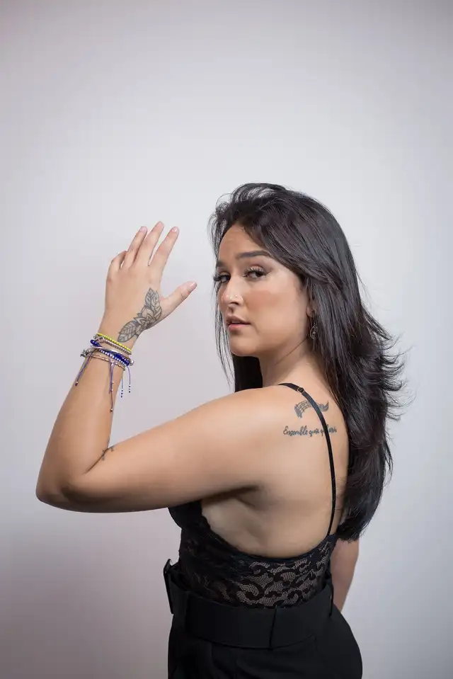 Daniela Darcourt tattoos: The matching back lettering she shares with her sisters
