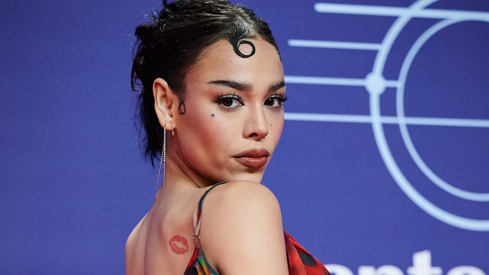 Danna Paola tattoos: red kiss tattoo full portrait