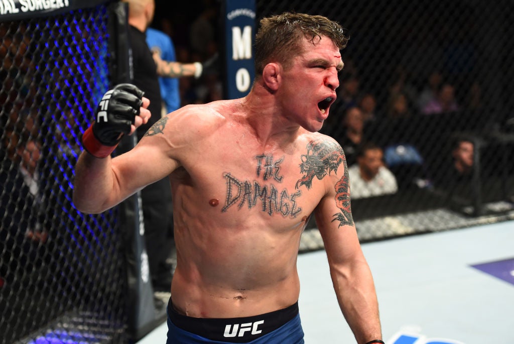 Darren Elkins tattoos: The Damage lettering across the chest