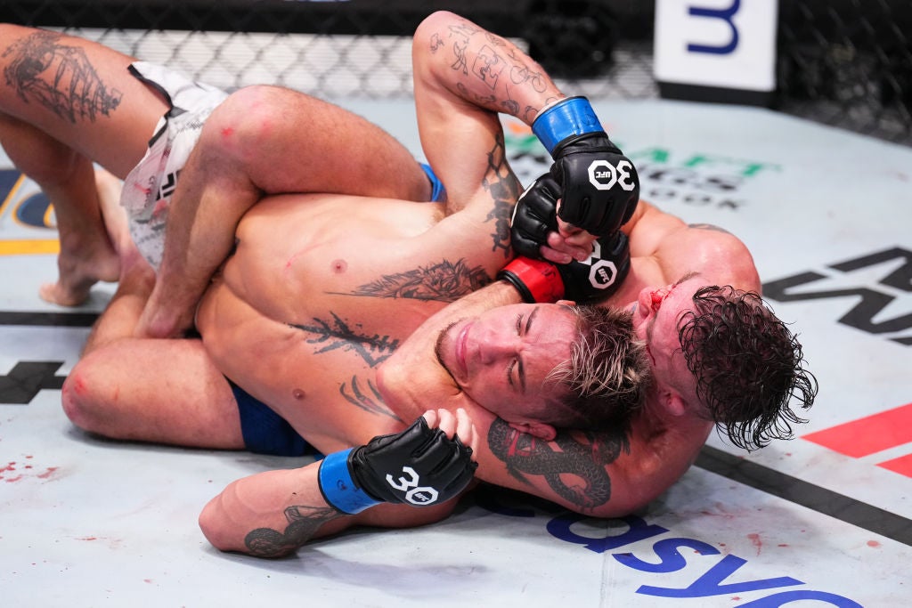 Darren Elkins tattoos: The dragon on the left upper arm