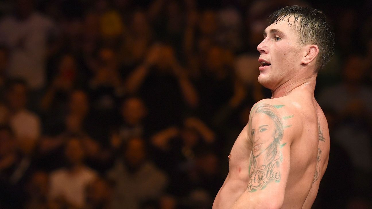 Darren Till showing his arm, back and neck tattoos