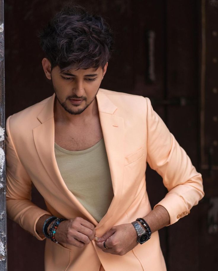 Darshan Raval in a contextual photograph: Separate contextual portrait establishing Raval's identity and public styling; not tattoo evidence.; not tattoo evidence