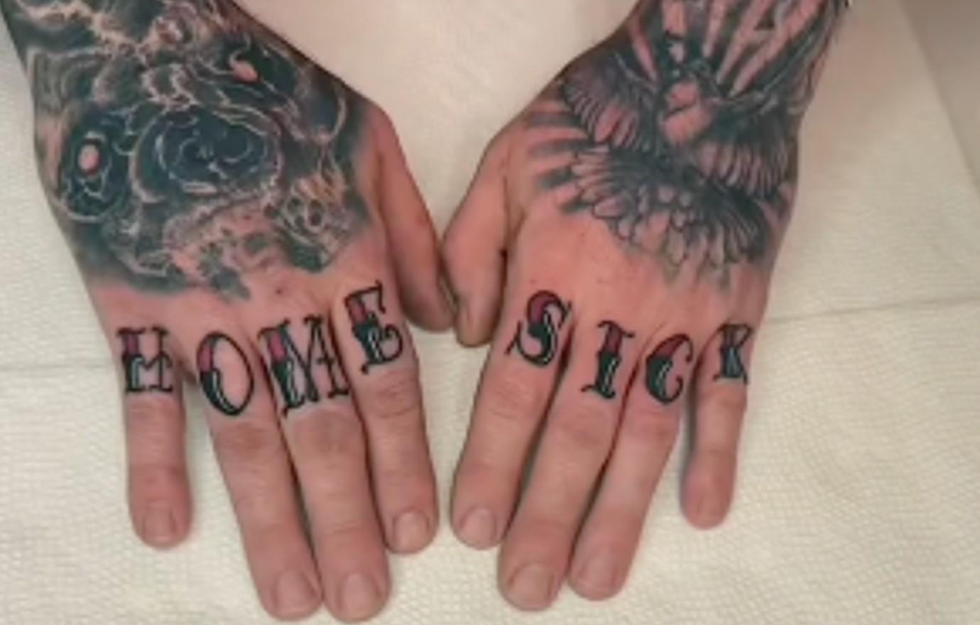 David Eason Close-up reference for the HOME SICK lettering and surrounding hand tattoos. David Eason tattoos: Close-up reference for the HOME SICK lettering and surrounding hand tattoos.