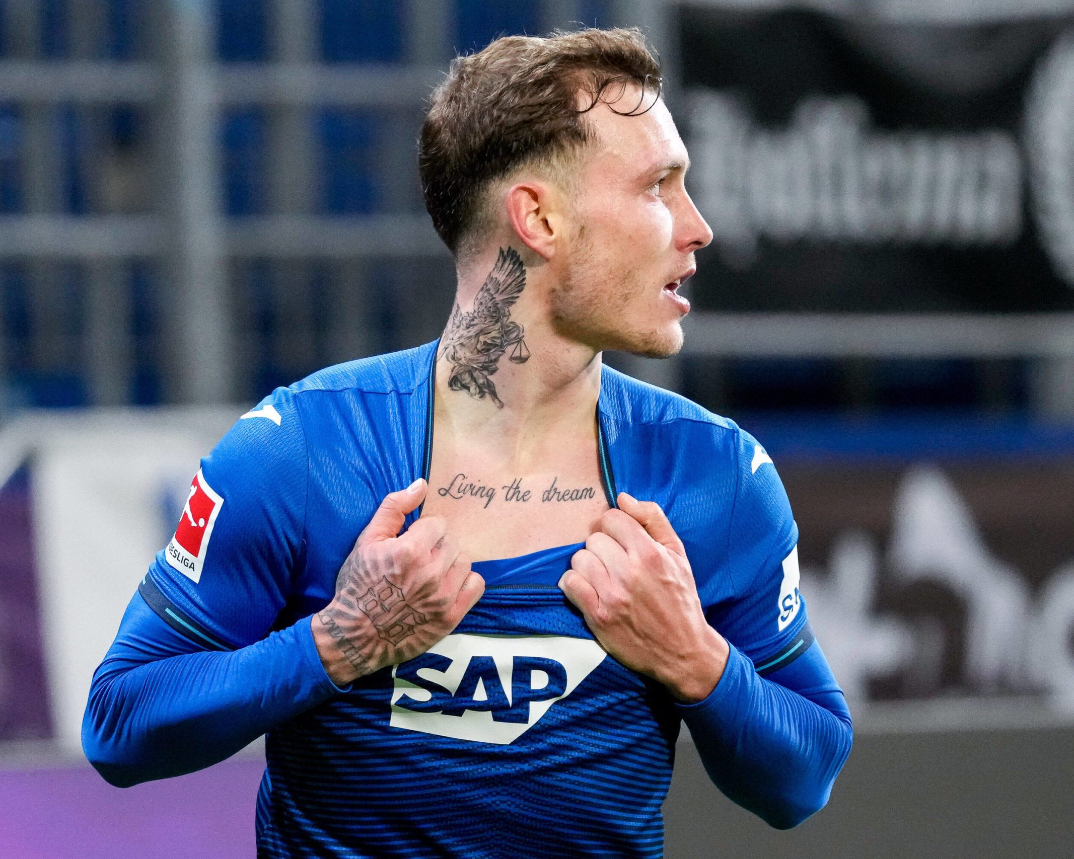 David Raum tattoos: Living the dream chest script during a goal celebration