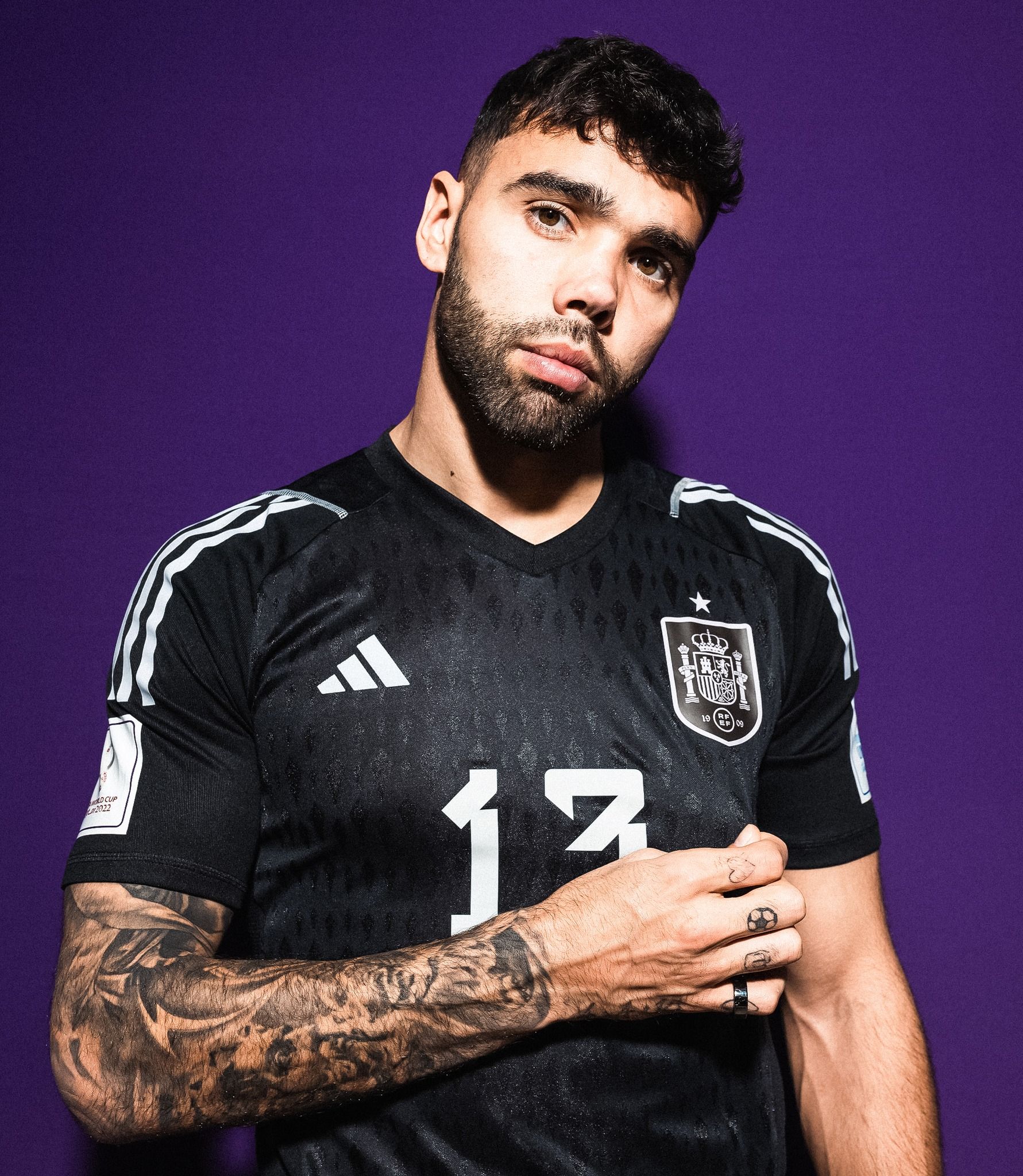 David Raya tattoos: close arm and hand view showing the sleeve, date detail and knuckle ink