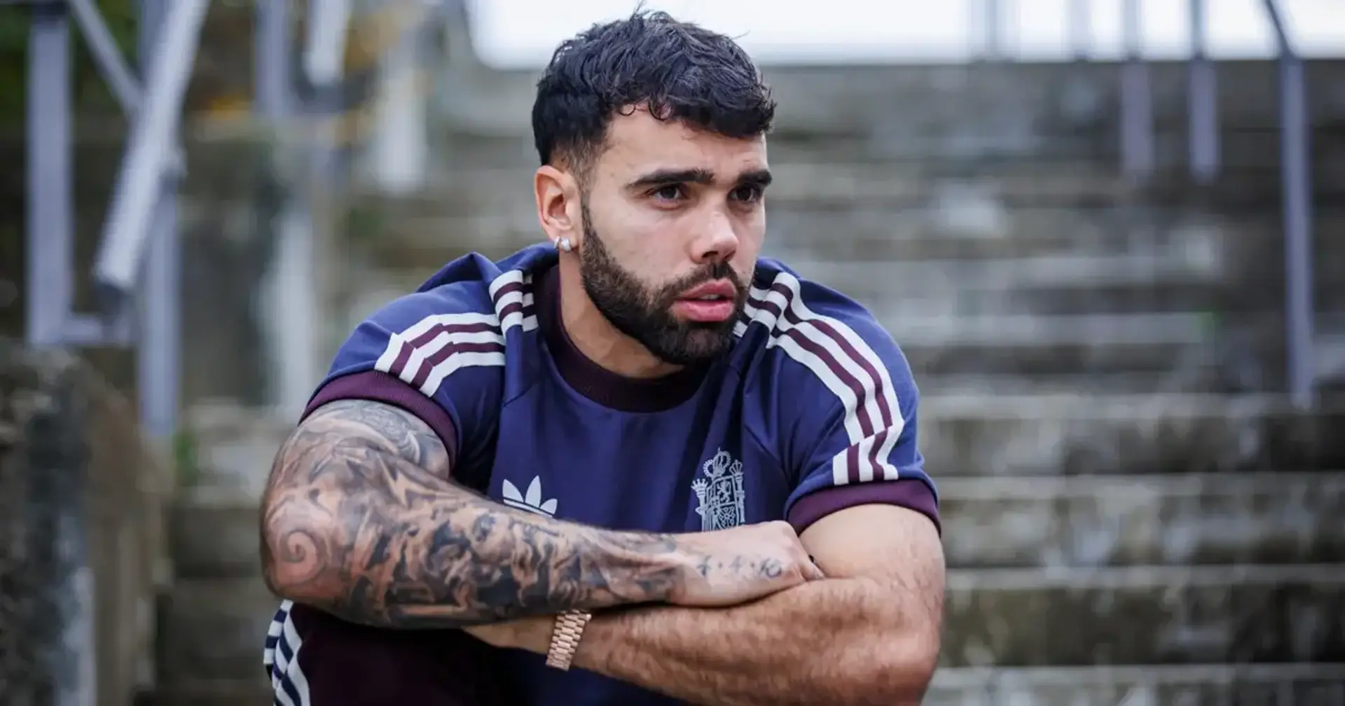 David Raya tattoos: wider training photograph showing how the black-and-grey forearm sleeve sits across a bent arm
