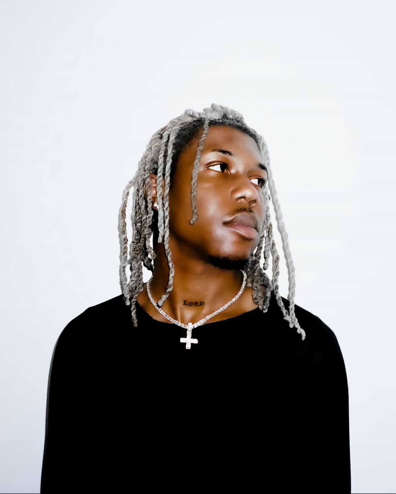 Destroy Lonely tattoos: high-resolution portrait showing the LORD neck tattoo and face-visible styling