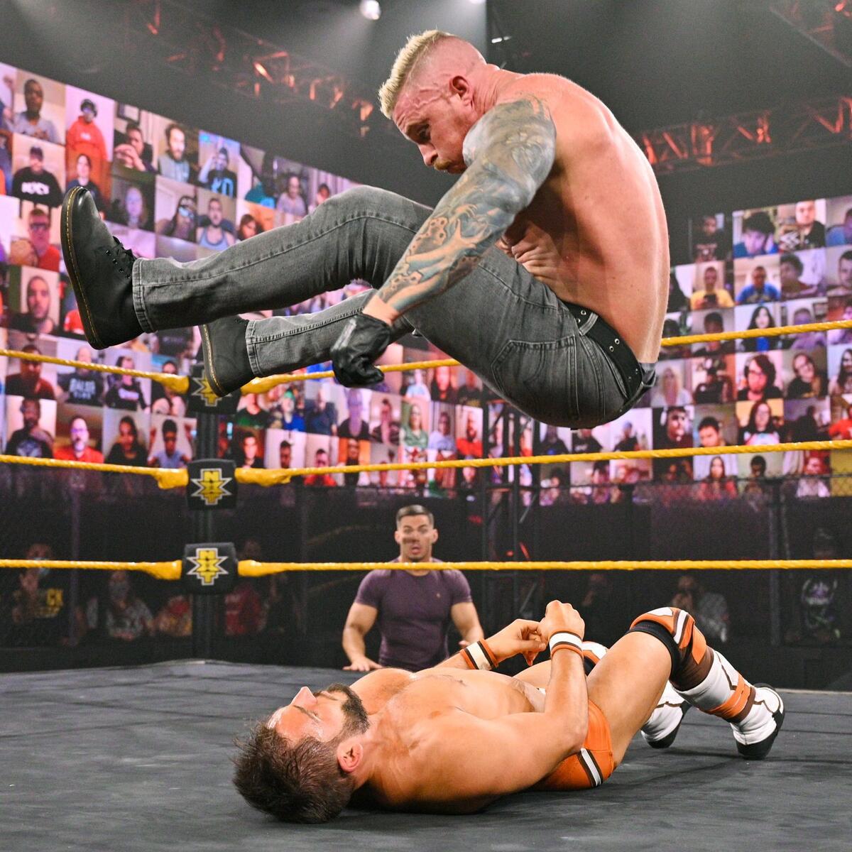Dexter Lumis tattoos: Outer left elbow and connected shoulder-to-wrist sleeve in an airborne pose