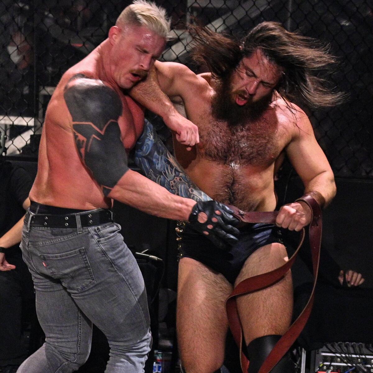 Dexter Lumis tattoos: Right shoulder and upper-arm dark fill, visible angular skin breaks