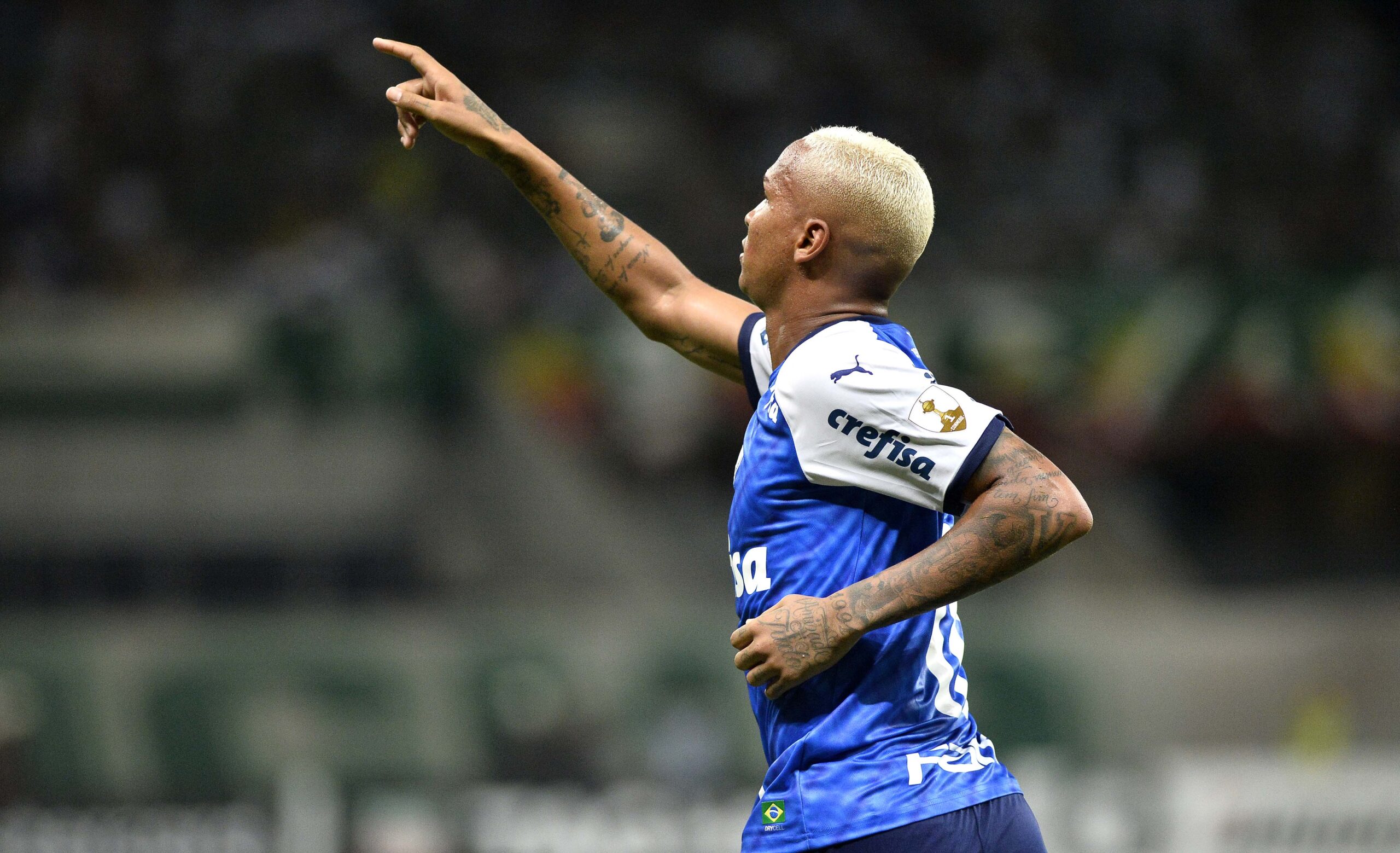 Deyverson points toward the stands in a Palmeiras celebration Deyverson in a contextual photograph: The personality behind the celebrations; not tattoo evidence