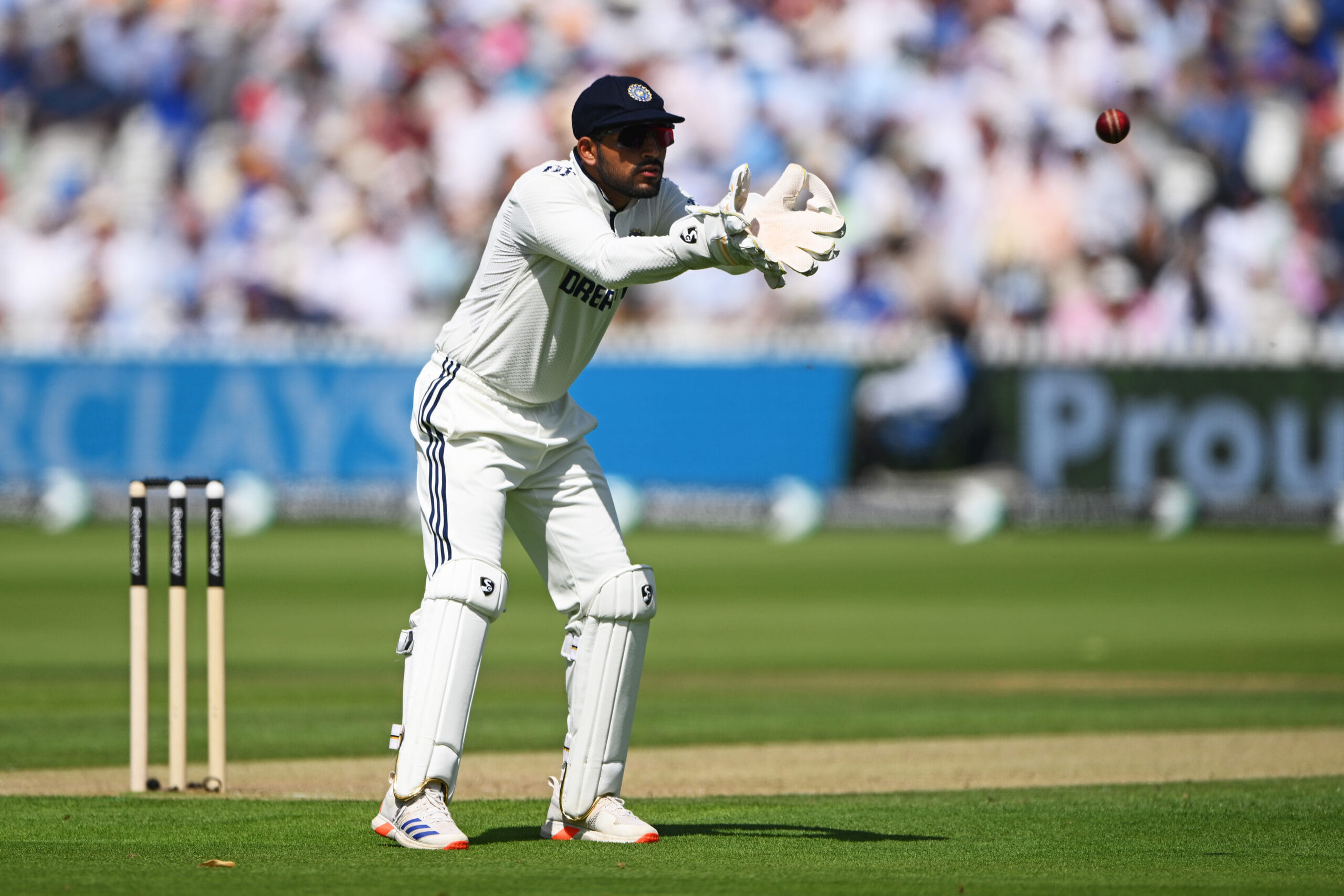 Dhruv Jurel in a contextual photograph: Contextual-only wicketkeeping action at Lord's, not tattoo evidence; not tattoo evidence