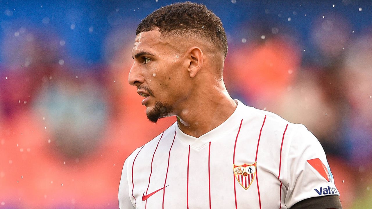 Diego Carlos tattoos: Sevilla profile photograph showing the tattooed forearm and neck from a side angle
