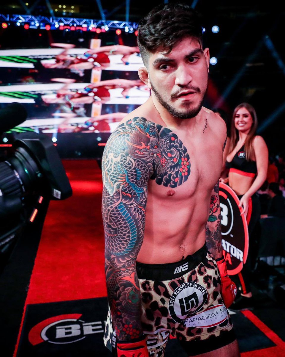 Dillon Danis showing his Bellator arm and shoulder tattoos