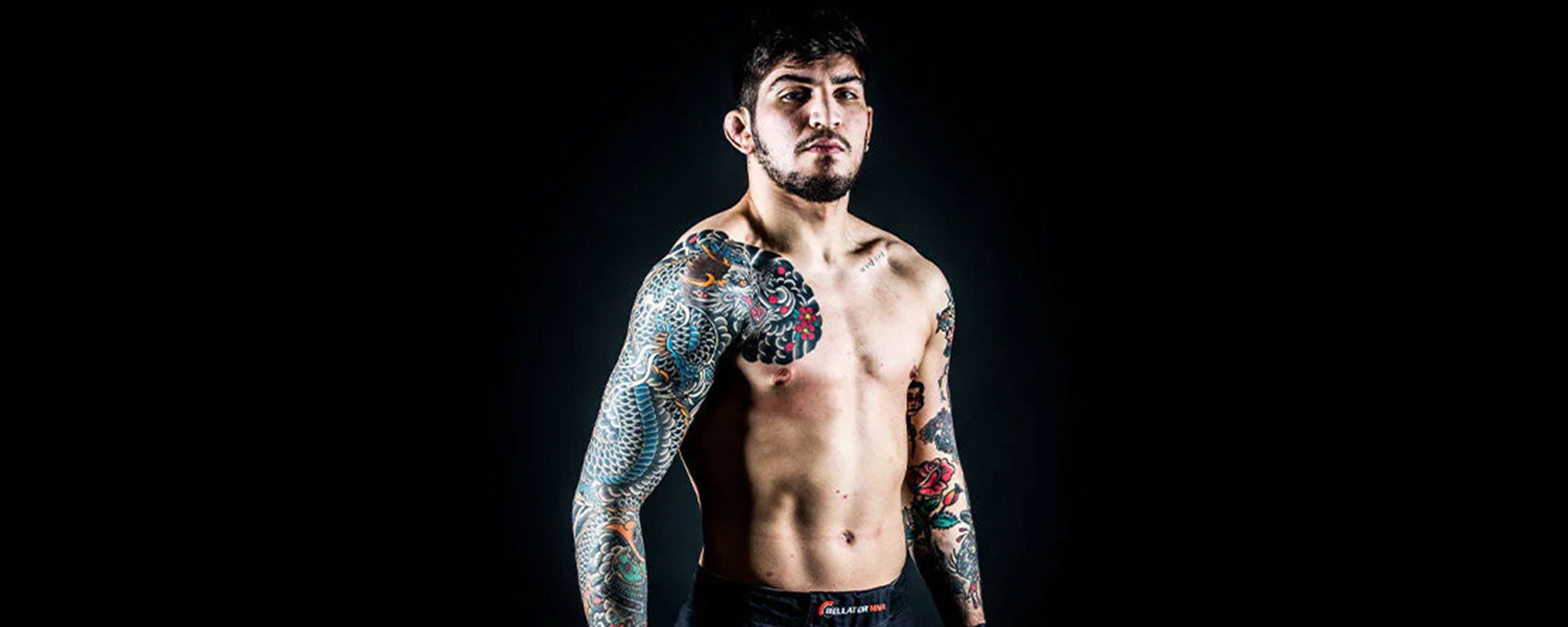 Dillon Danis showing his colorful chest and shoulder tattoos