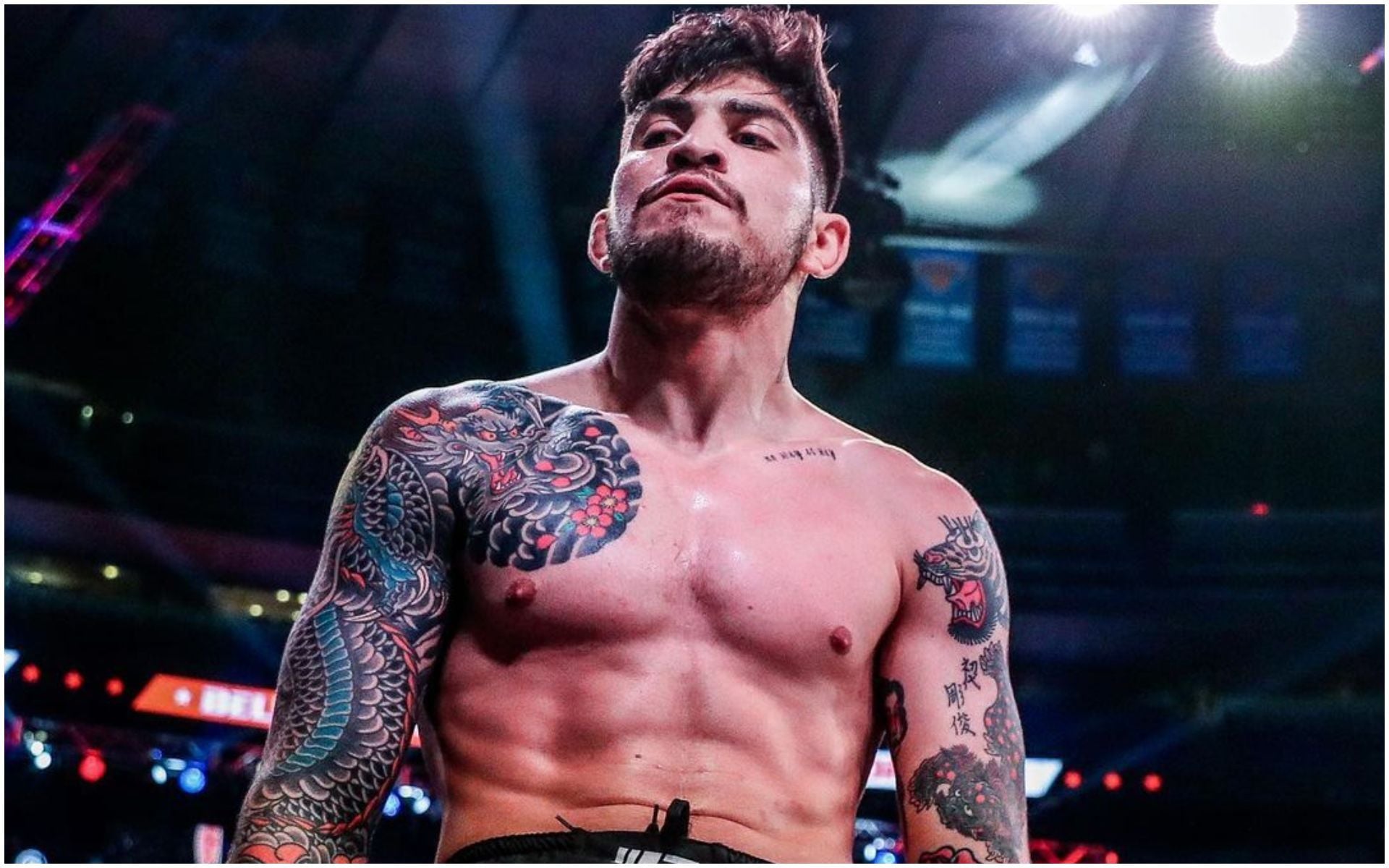 Dillon Danis showing his Japanese-style dragon sleeve tattoos