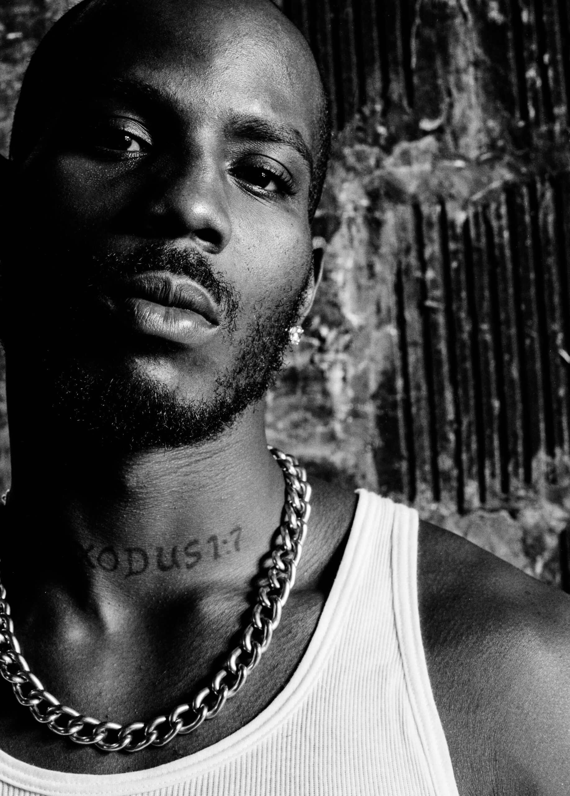 DMX tattoos: close press portrait showing the EXODUS throat tattoo and upper chest placement