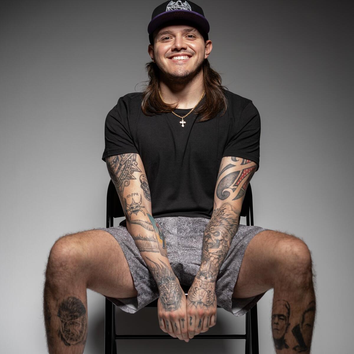 Dominik Mysterio arm symbols tattoo