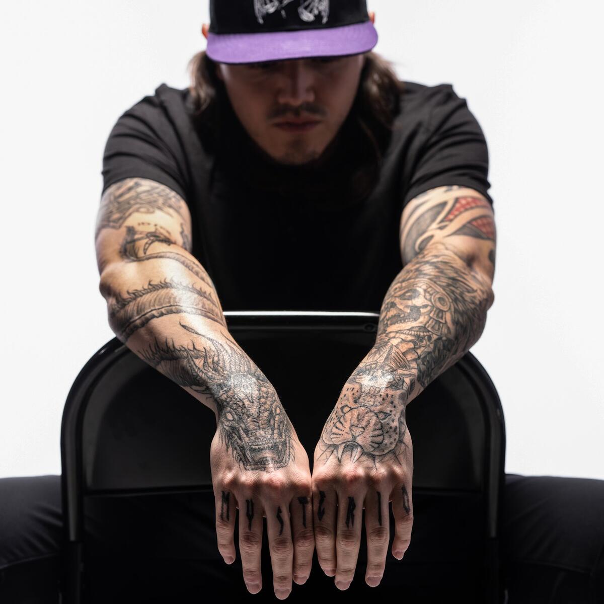 Dominik Mysterio forearm tattoos