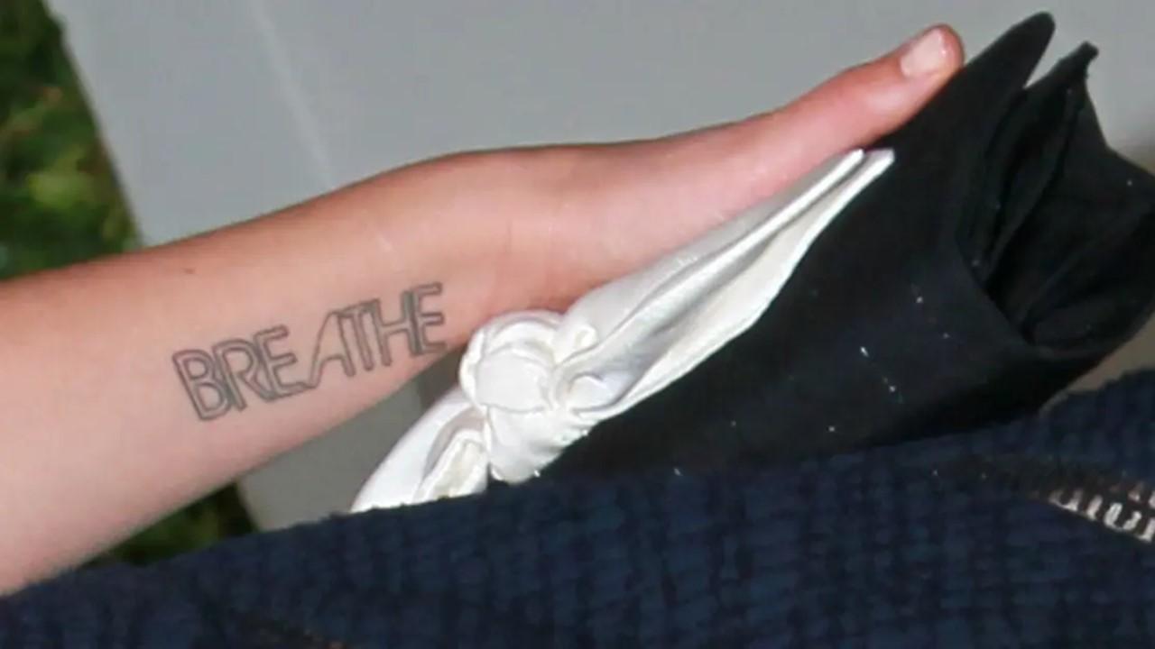Drew Barrymore breathe tattoo