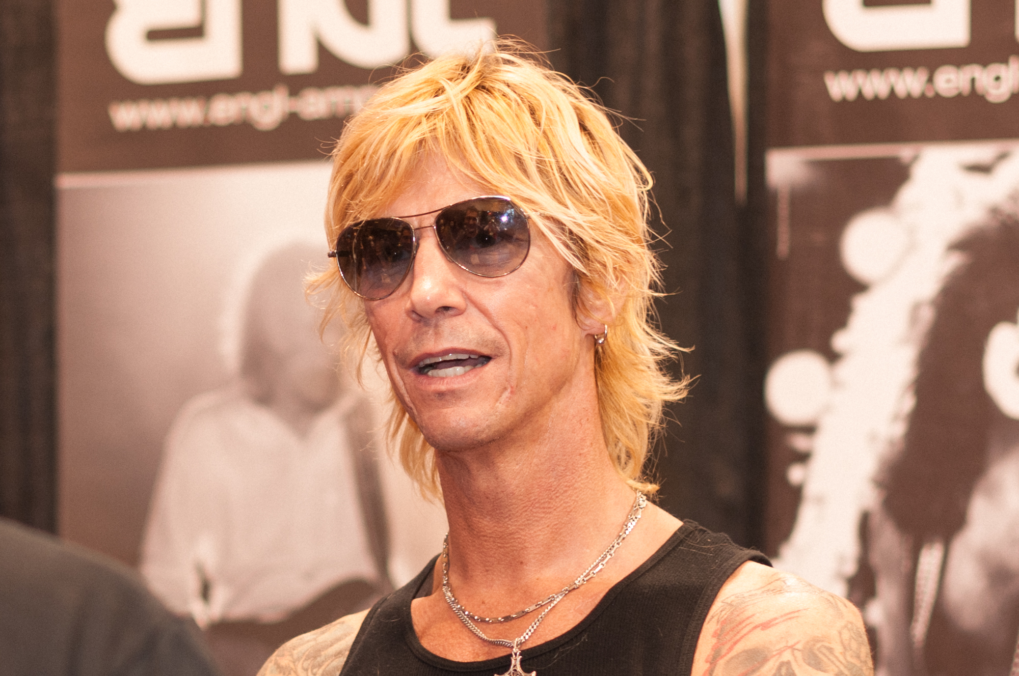Duff McKagan sleeve tattoos on stage