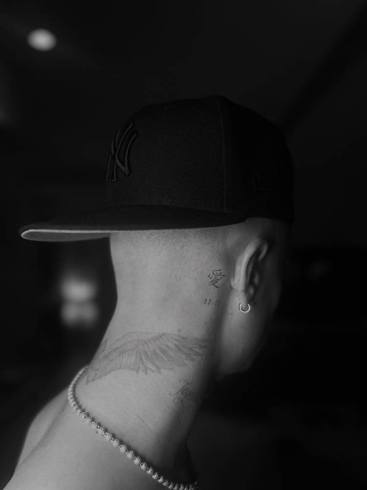 Romeo Beckham neck and ear tattoos