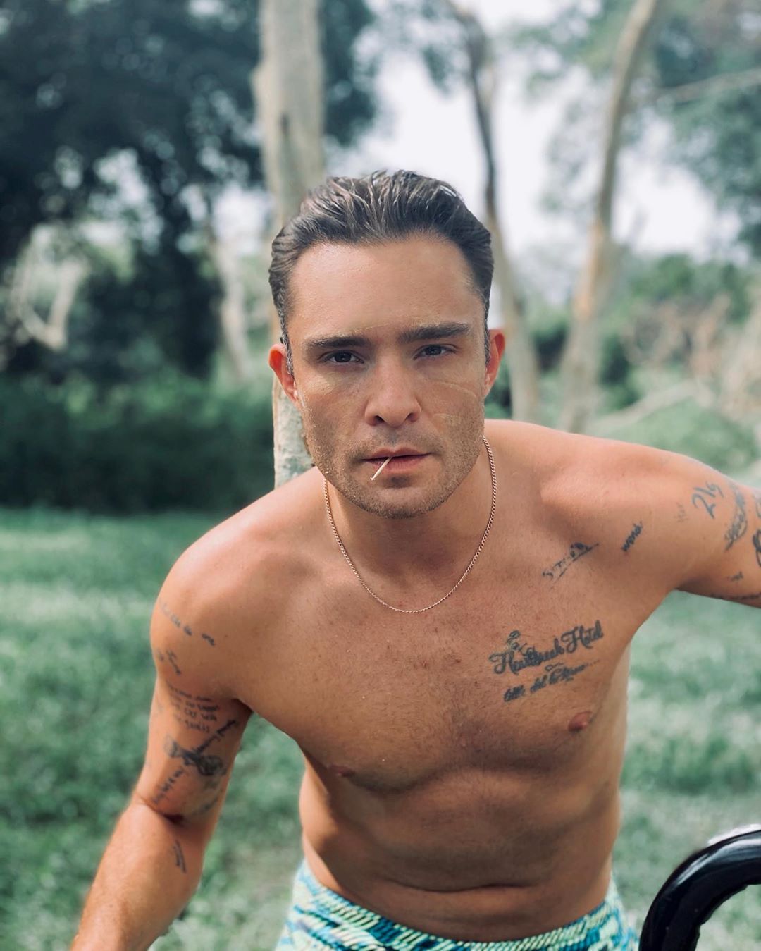 Ed Westwick tattoos: forearm script and visible arm ink