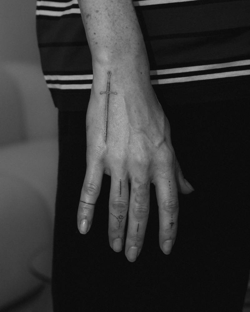Ellie Goulding tattoos: Ellie Goulding's tiny hand symbols