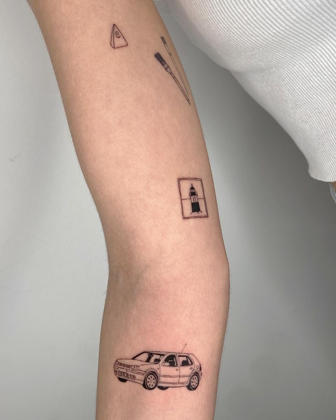 Emma Chamberlain tattoos: Close-up arm collage showing named line-art motifs