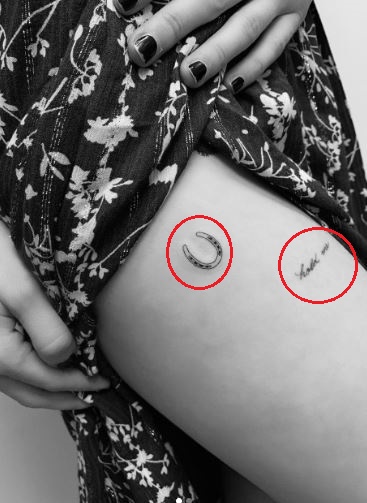 Emma Roberts genuine tattoo photograph showing the horseshoe beside hold me lettering Emma Roberts tattoos: genuine tattoo photograph showing the horseshoe beside hold me lettering