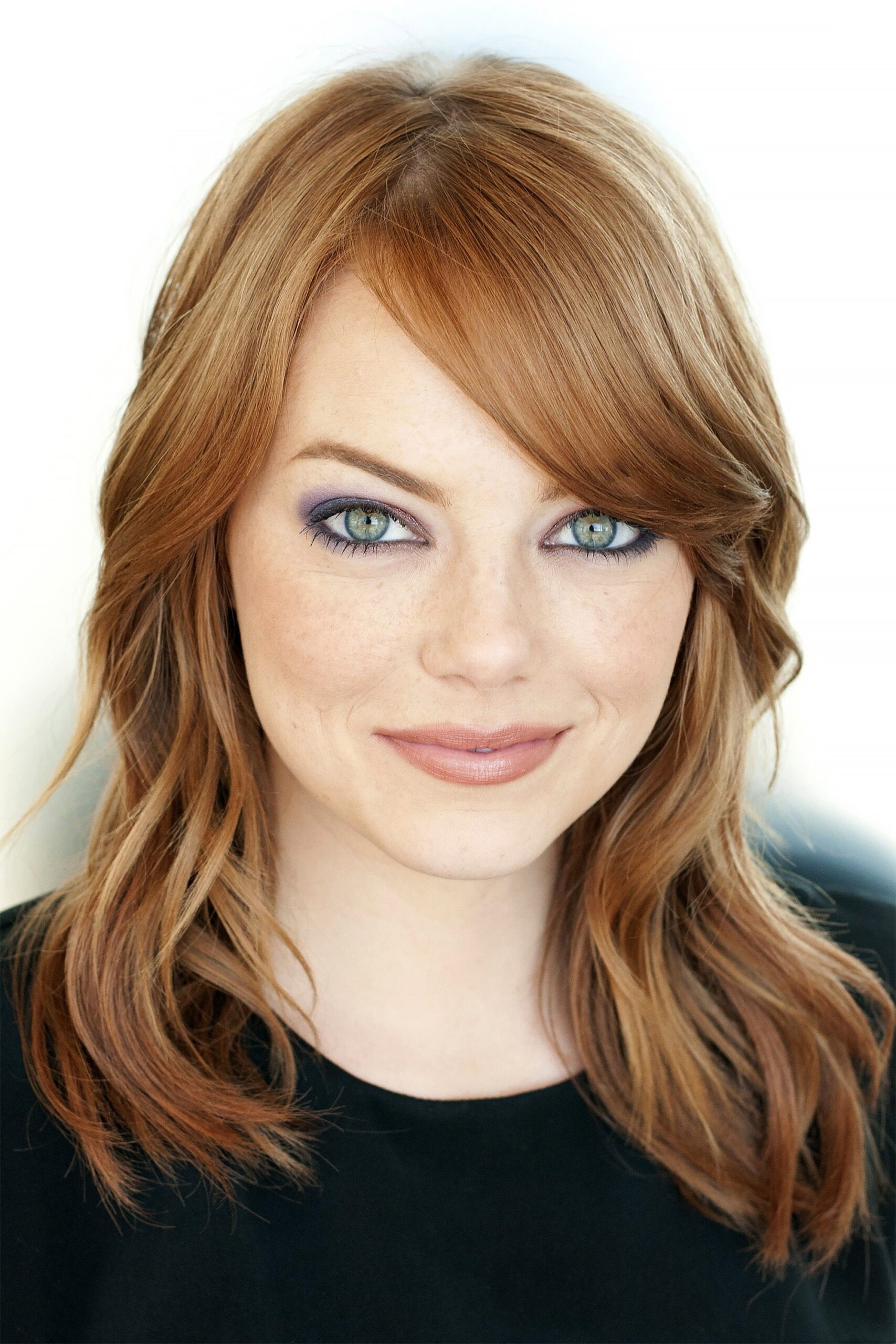 Emma Stone in a contextual photograph: Contextual portrait; not tattoo evidence.; not tattoo evidence
