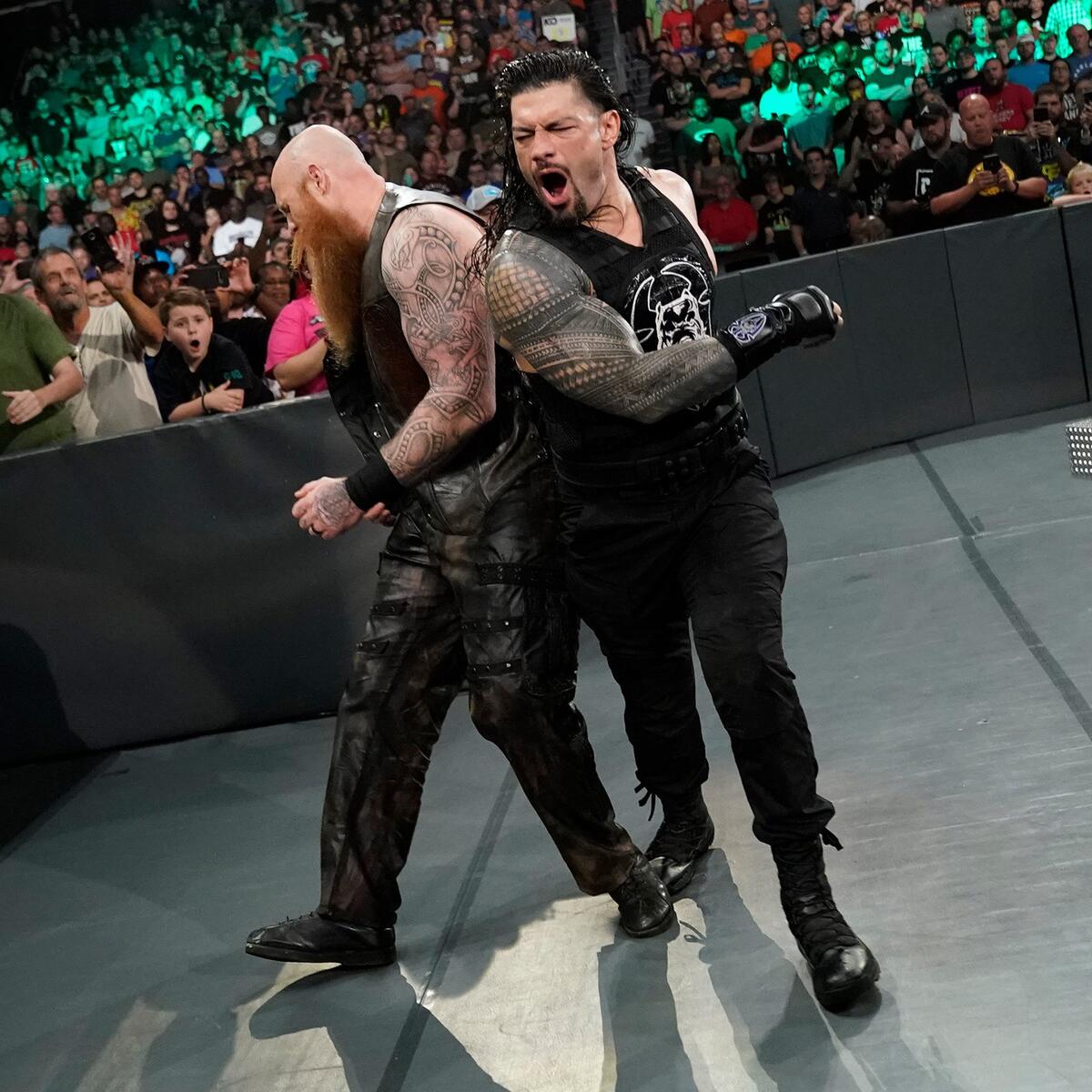 Erick Rowan tattoos: Left outer shoulder curved decorated borders and looping shapes