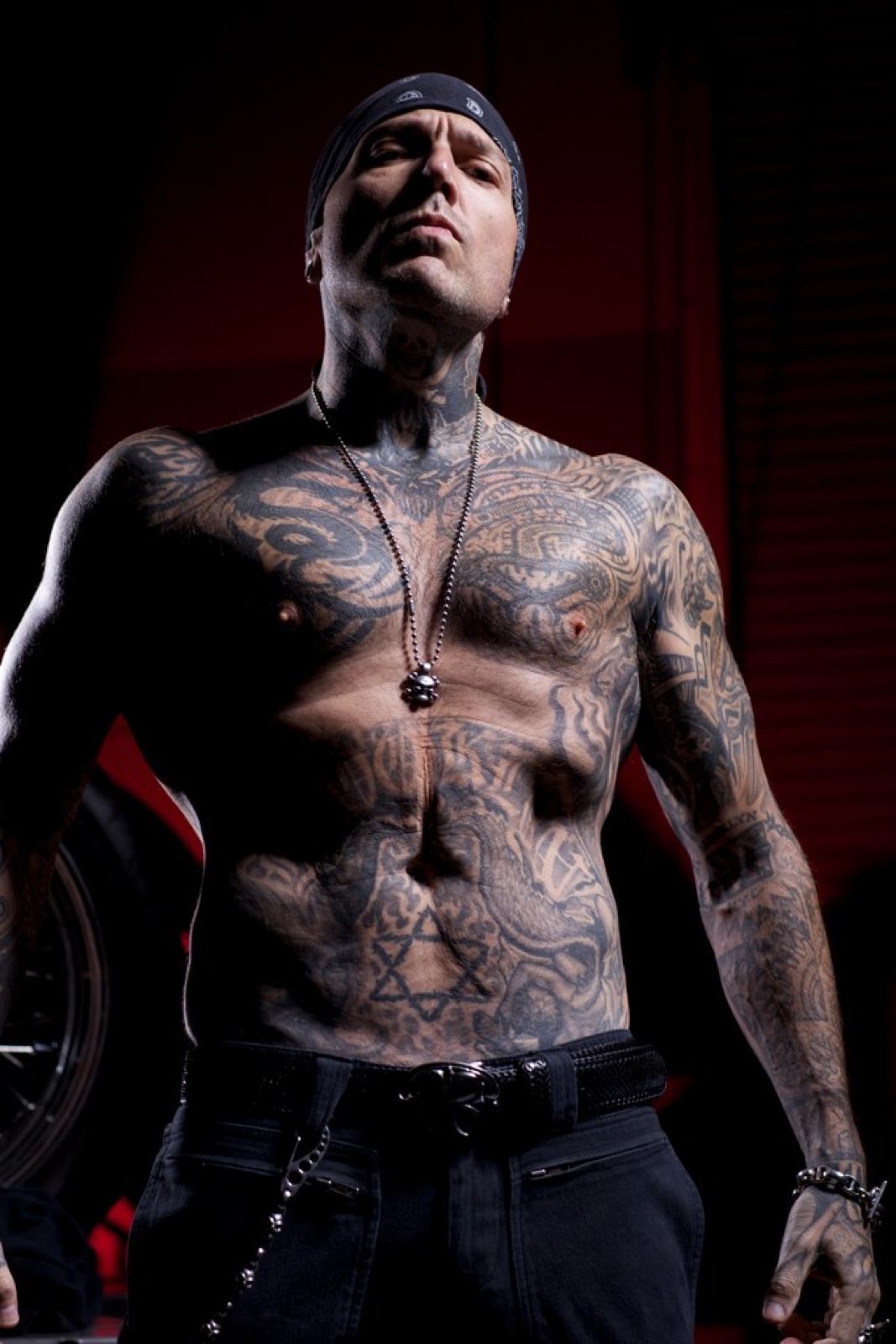 Evan Seinfeld torso, neck and arm tattoo details