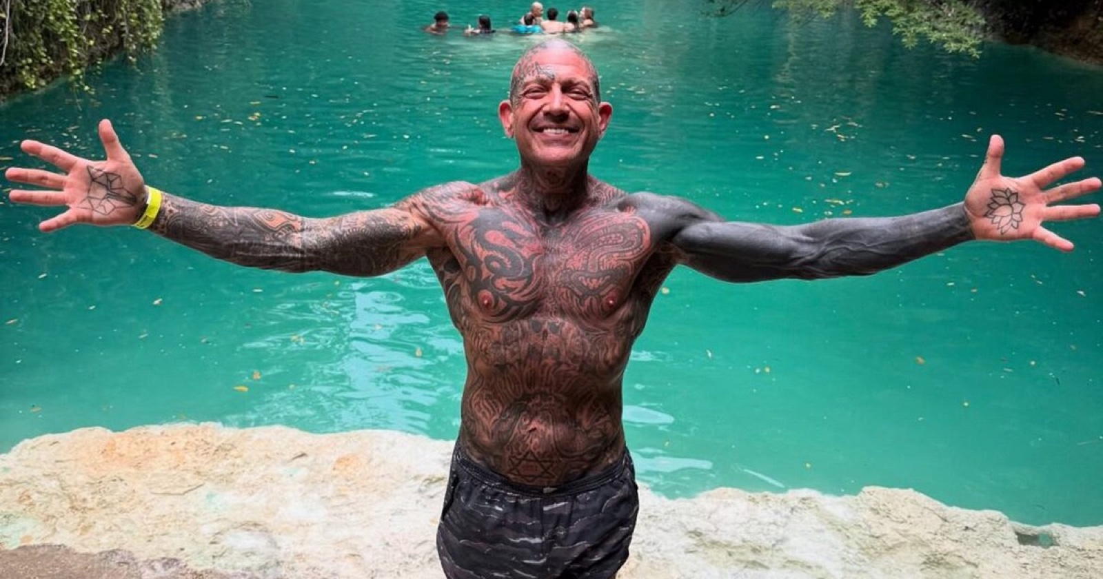 Evan Seinfeld showing full torso and arm tattoos