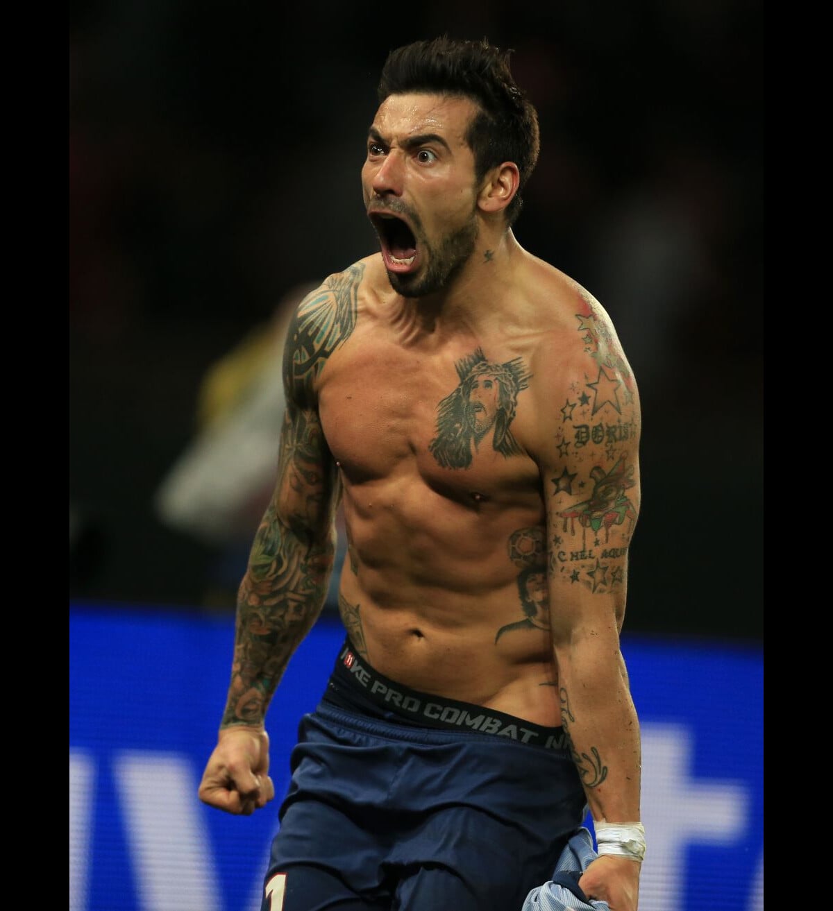 Ezequiel Lavezzi tattoos: high-resolution celebration photo showing colorful sleeves, chest and shoulder ink