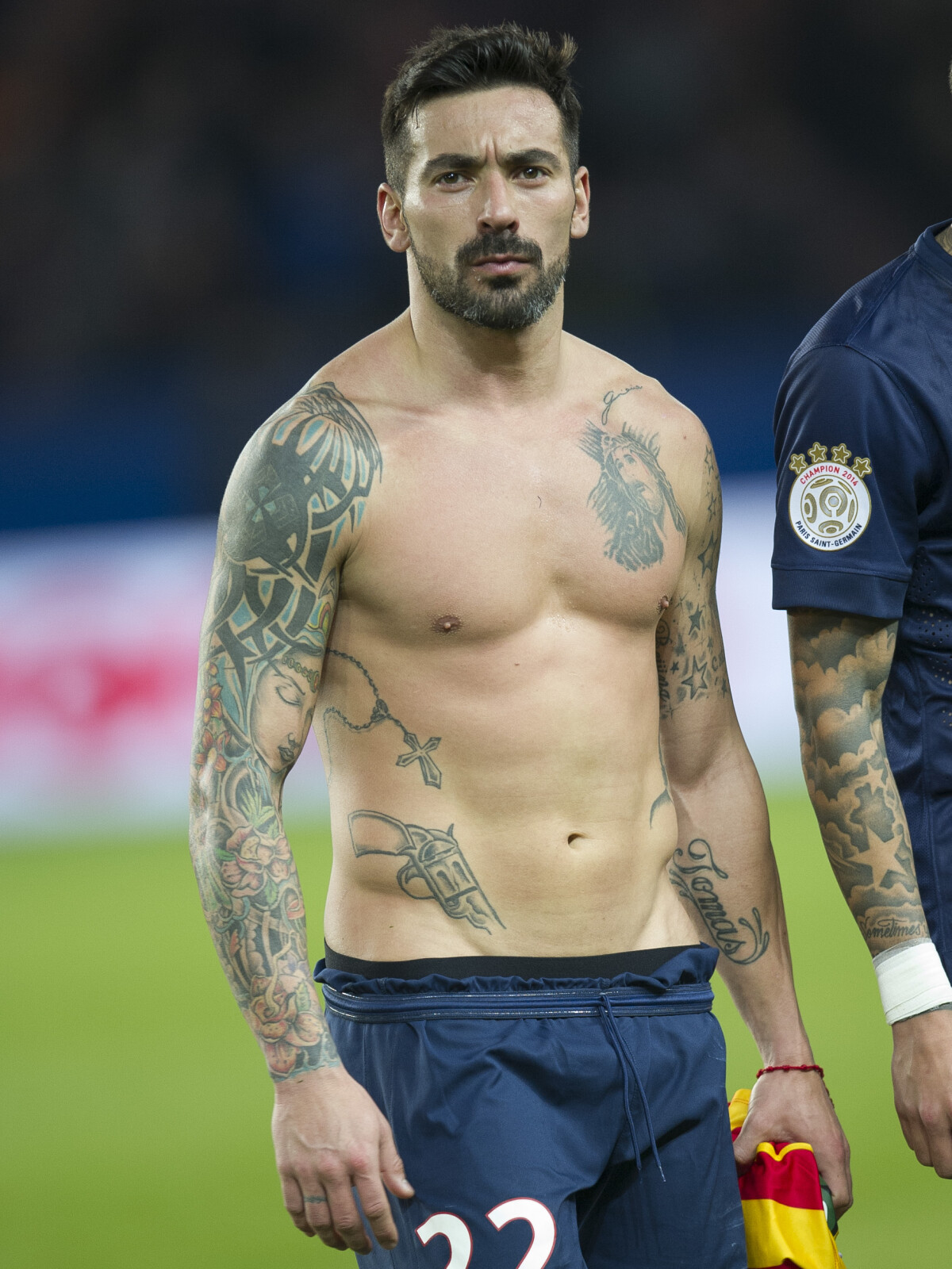 Ezequiel Lavezzi tattoos: large match-day portrait showing the Jesus chest portrait and torso layout