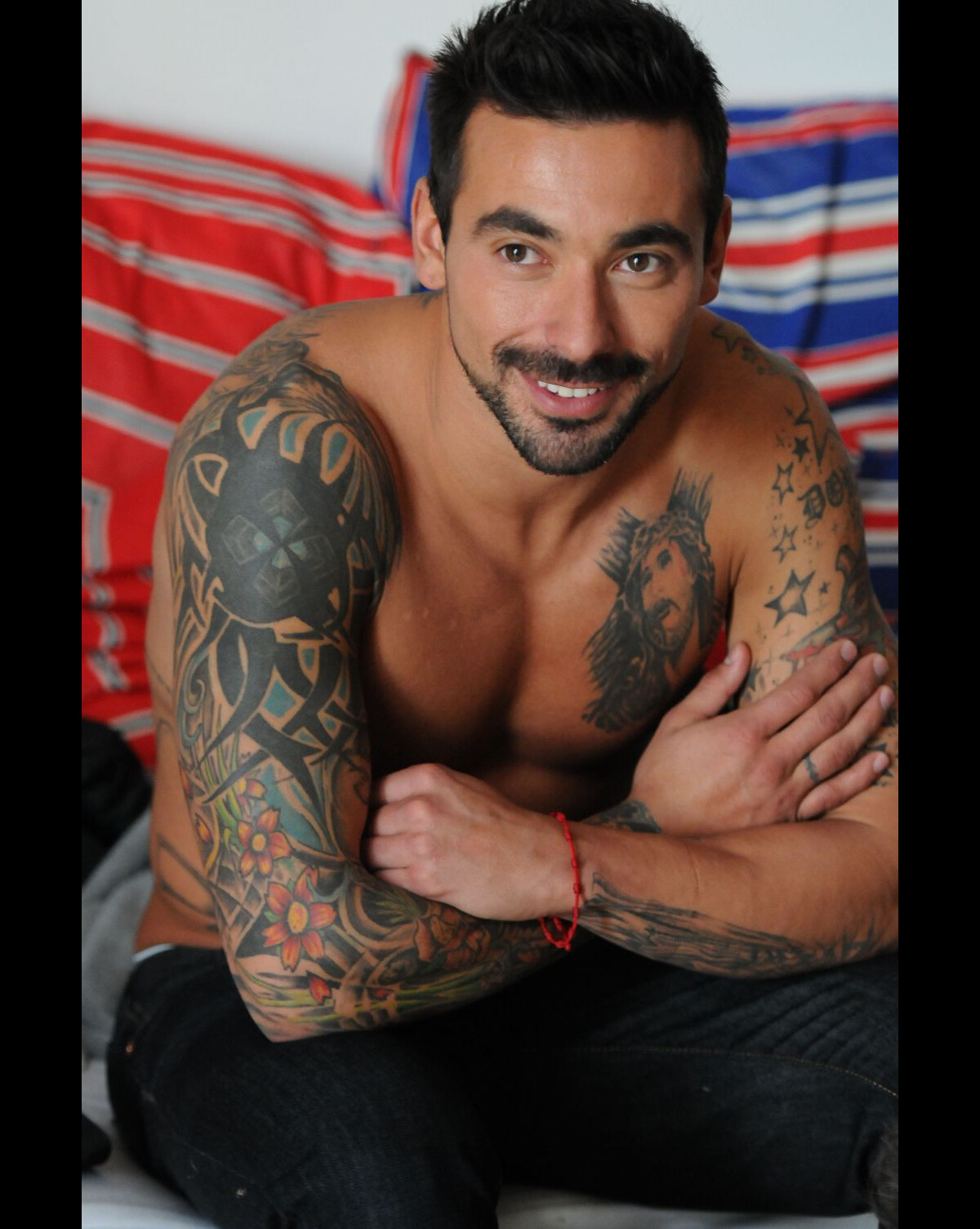 Ezequiel Lavezzi tattoos: separate high-resolution portrait showing neck star, shoulder and sleeve transition