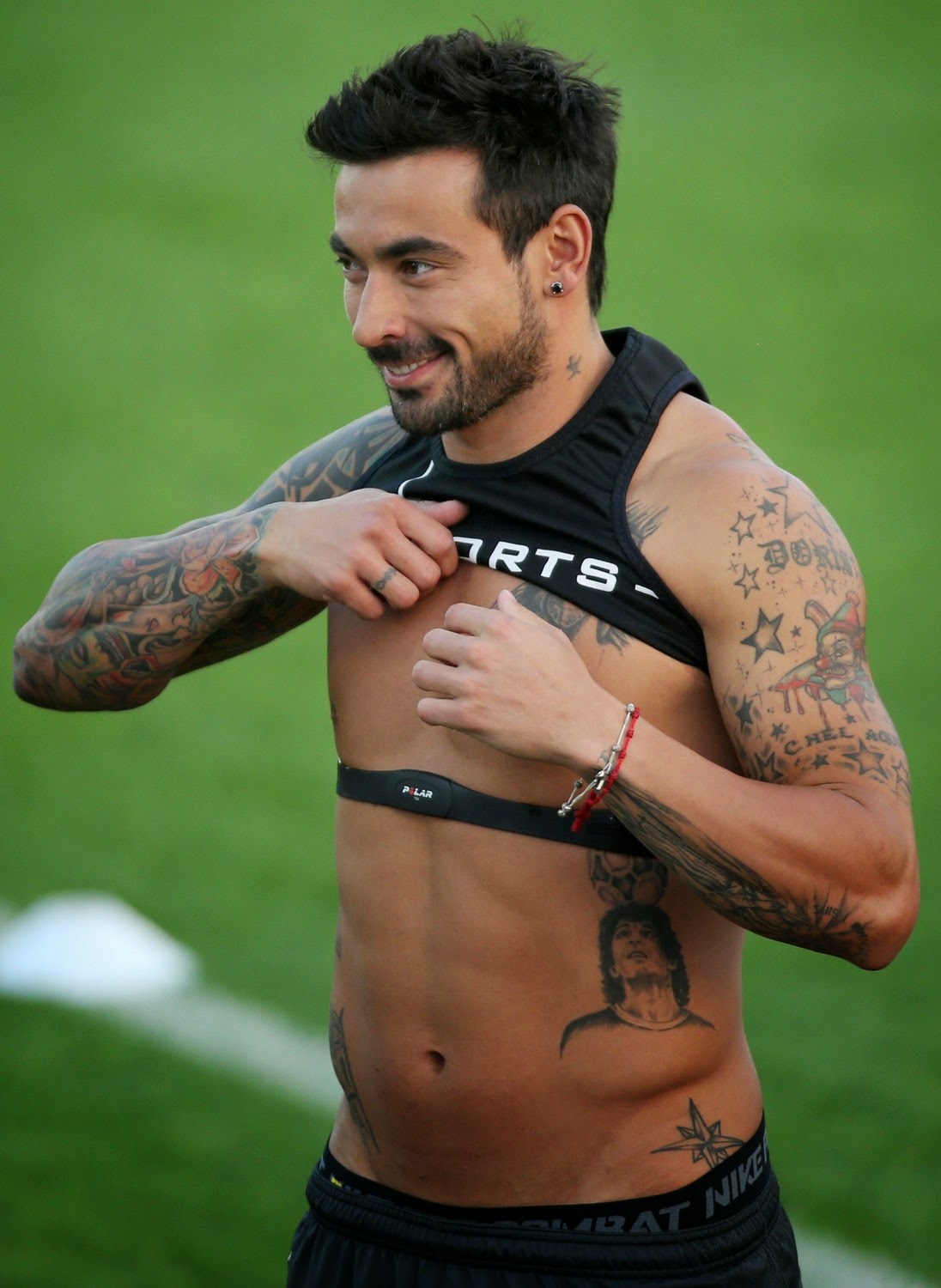 Ezequiel Lavezzi tattoos: full-resolution training image showing stars, lettering, symbols and arm coverage