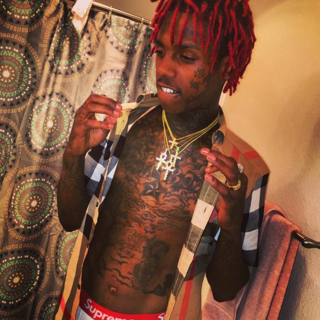 Famous Dex tattoos: high-resolution portrait showing chest, neck and hand tattoos from a different angle