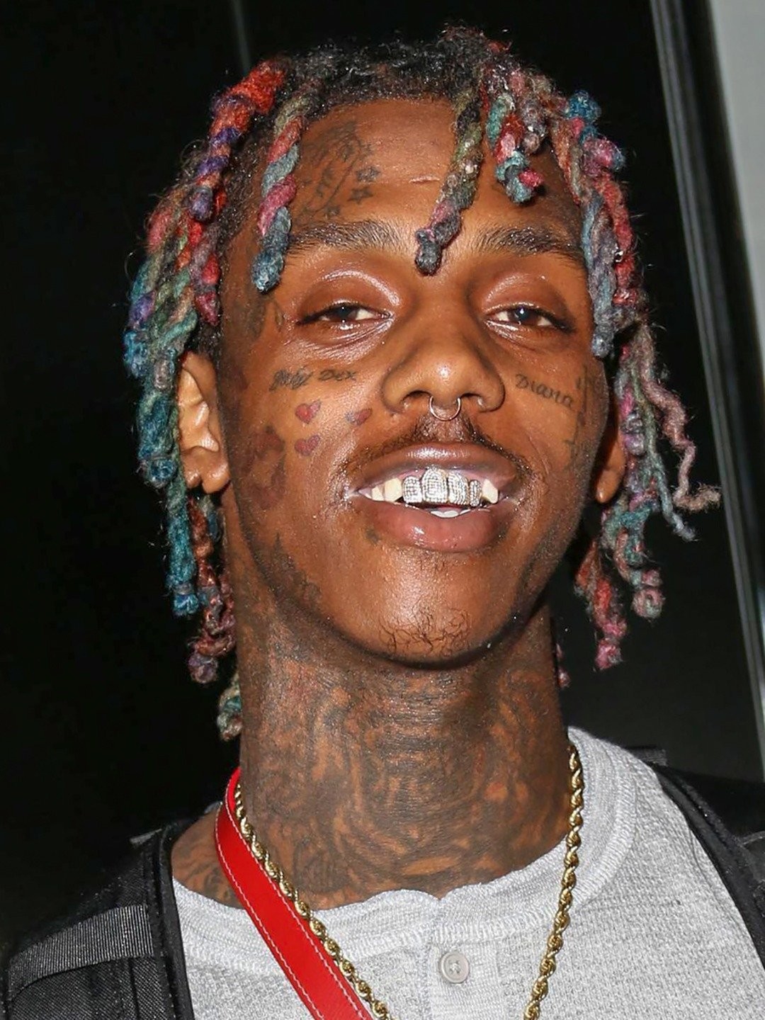Famous Dex tattoos: high-resolution close portrait showing the face and neck tattoo layout