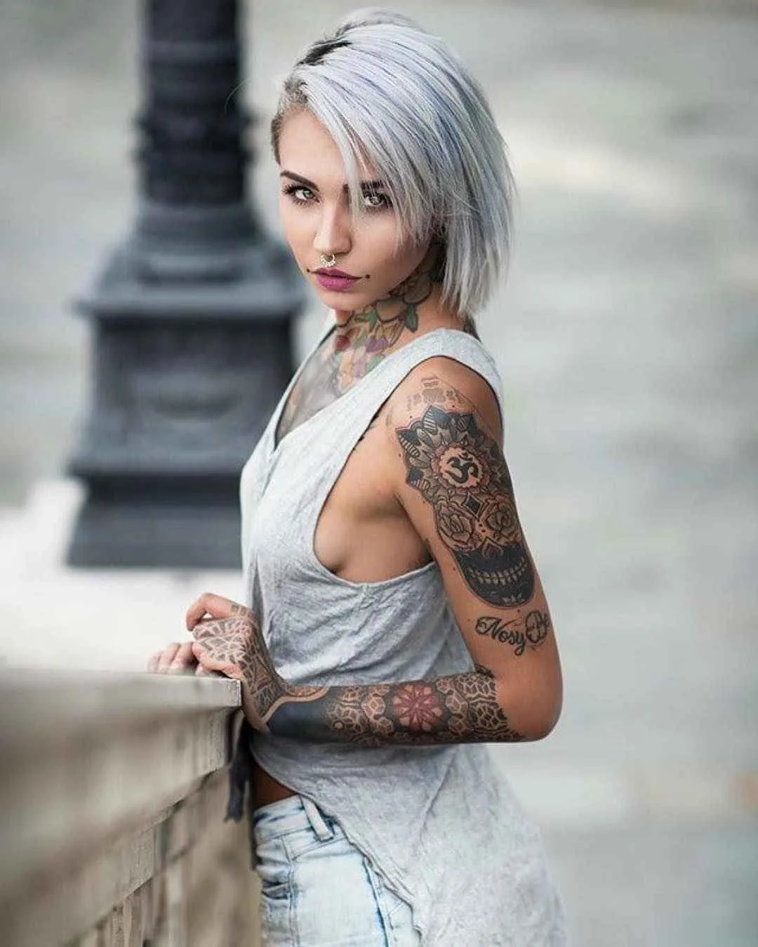 Fishball tattoos: Decorated Mexican skull and Nosy Be script