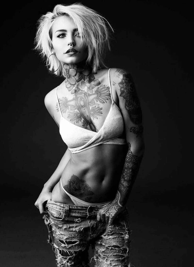 Fishball tattoos: Large flowers and leaves wrapping front of neck